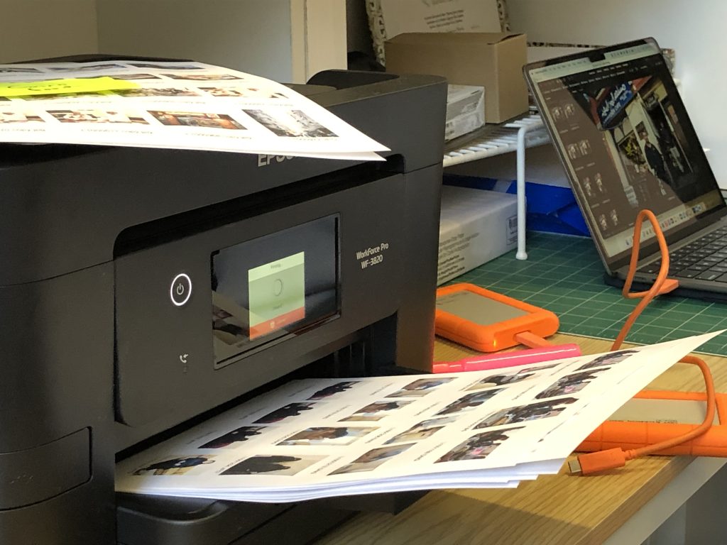 Design workspace showing book development process with layout materials and proofs
