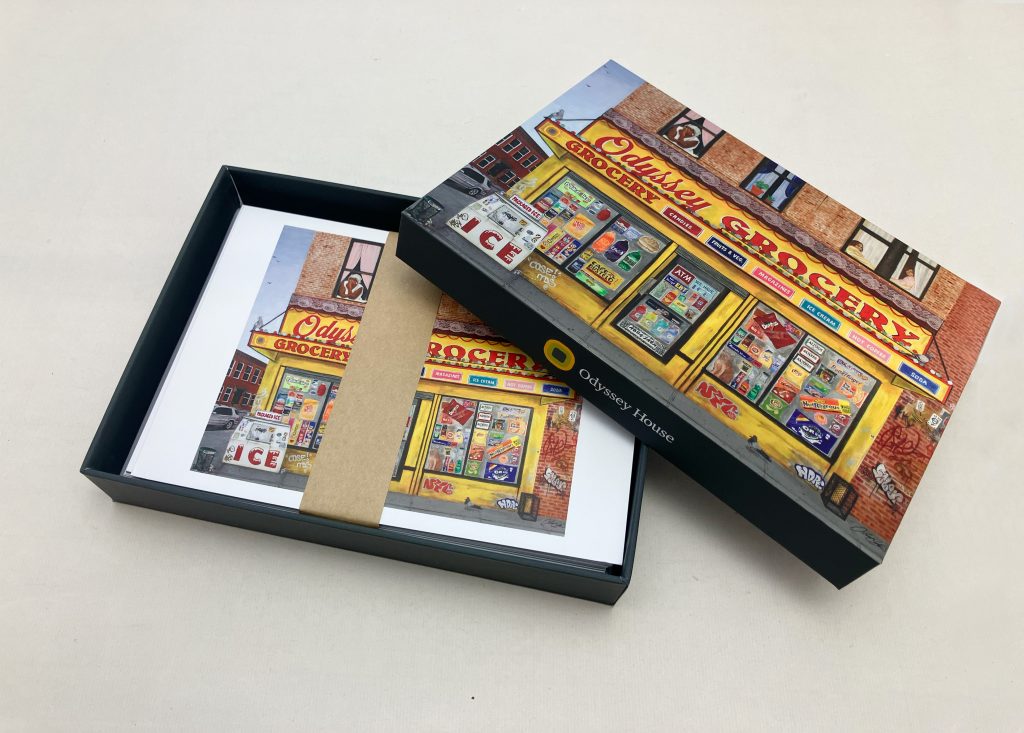 Open note card set displaying individual cards with client artwork and coordinated design elements
