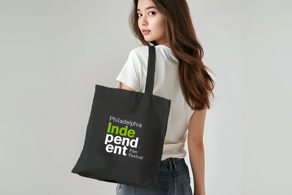 Black tote bag displaying PIFF logo in clean, minimalist design